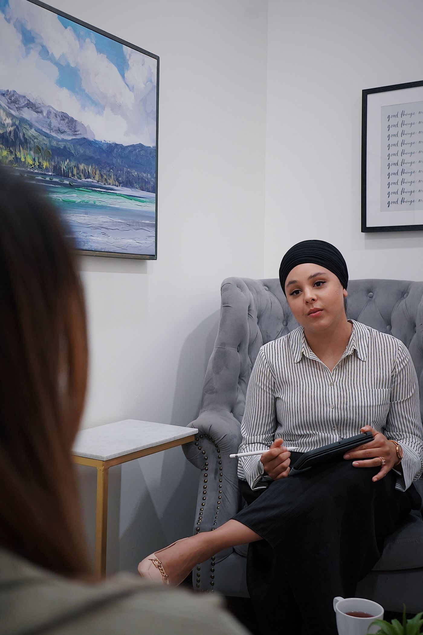 Therapist taking notes during a session