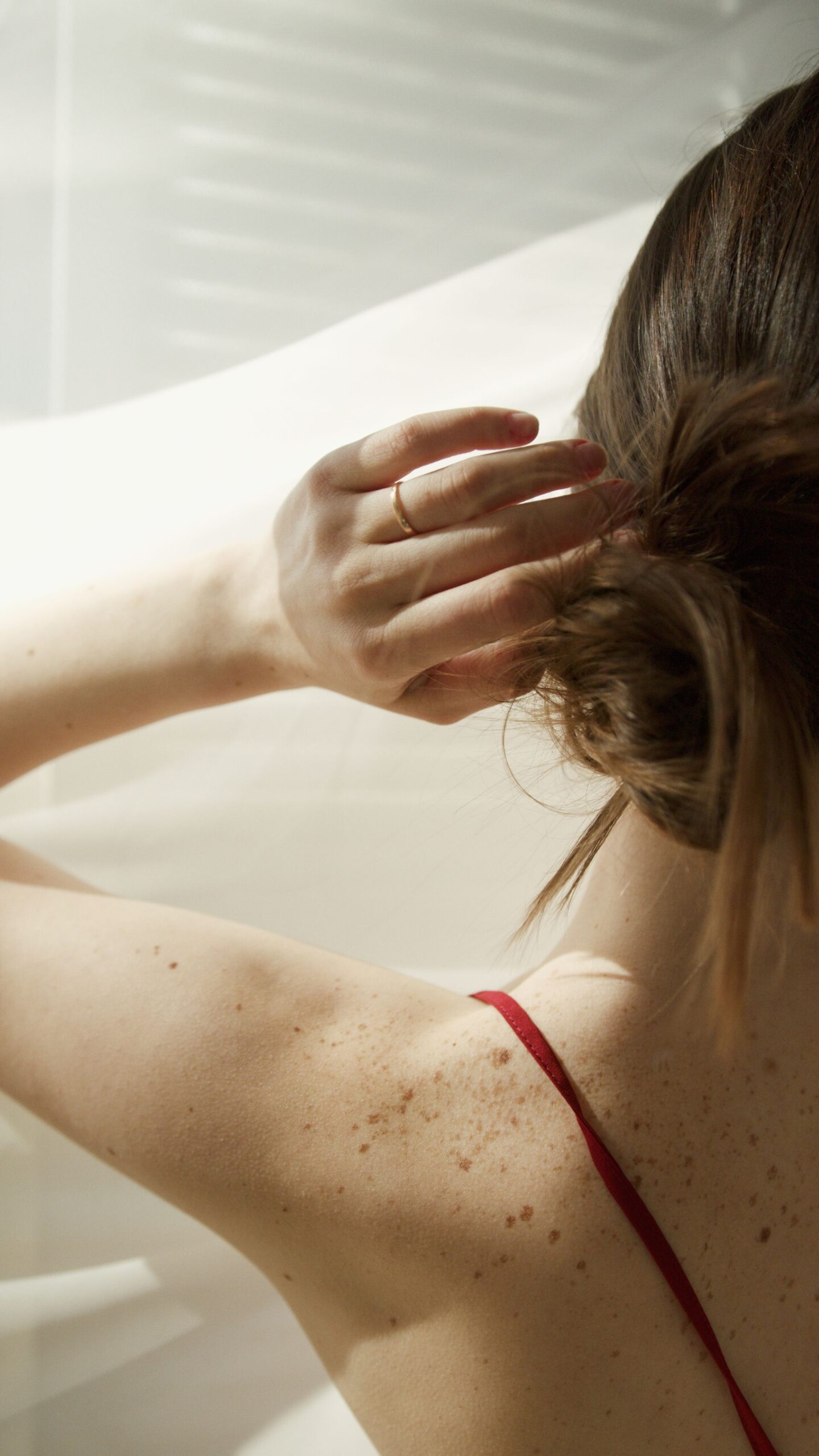 Close-up of a hand running through hair